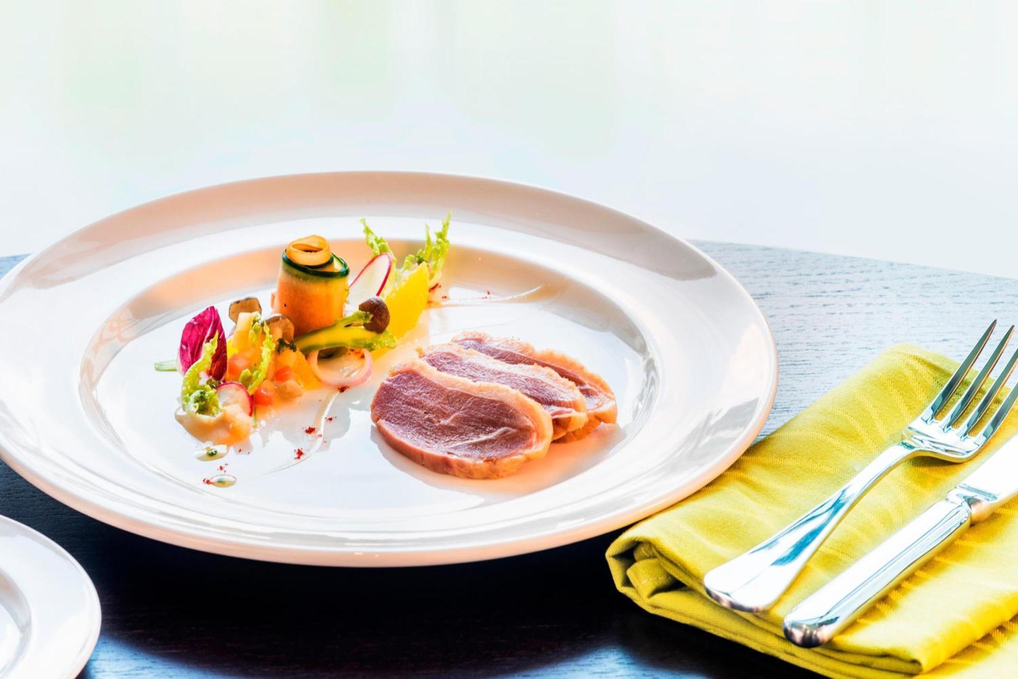 Le Meridien Putrajaya Exterior photo A plate of duck confit